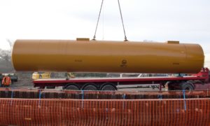 Fuel tank being lifted into excavation Formby Service Station